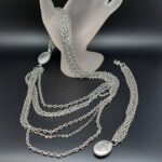 Parure anni ‘60 firmata Avon, composta da collana e bracciale, in metallo color argento - VINTAGE AMOREMIO